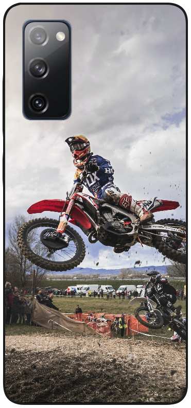 man riding red motocross dirt bike